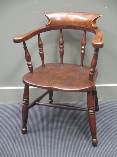Lot 626 - Circa 1830 an elm broad arm captains chair