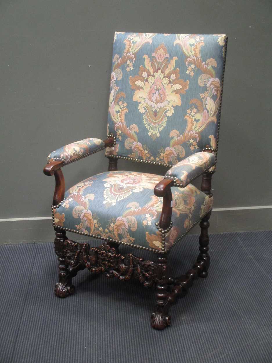 Lot 820 - An early 19th century carved walnut upright...