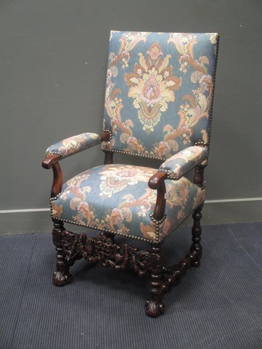 Lot 506 - An early 19th century carved walnut upright...