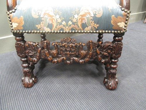 Lot 820 - An early 19th century carved walnut upright...