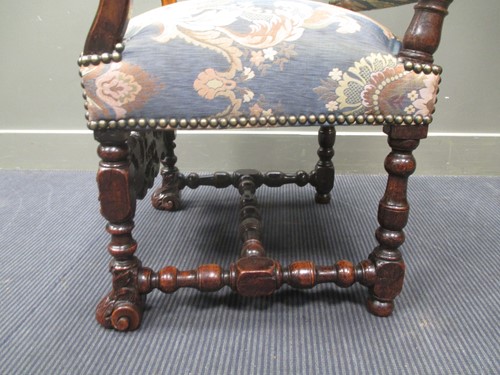 Lot 820 - An early 19th century carved walnut upright...