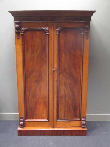 Lot 799 - A mahogany two door wardrobe with moulded...