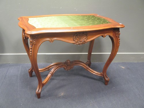 Lot 696 - A carved centre table on cabriole legs with...