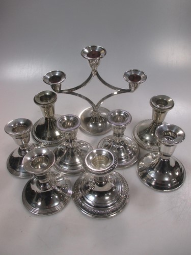 Lot 429 - Six dwarf silver candlesticks with weighted...