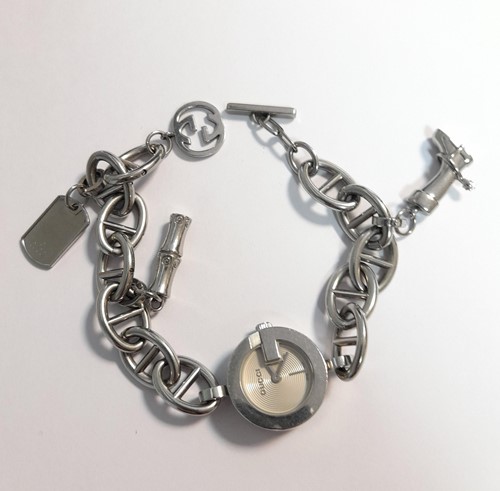 Lot 402 - A ladies Gucci G watch, charm bracelet model...