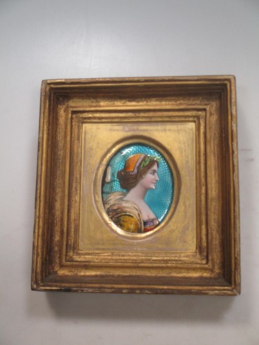 Lot 312 - An enamelled female profile bust miniature...