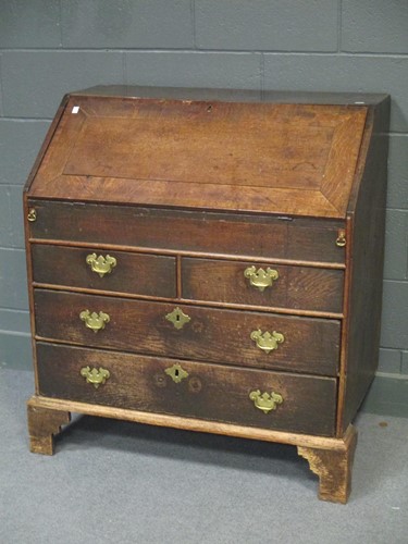 Lot 841 - An 18th century oak and crossbanded bureau,...
