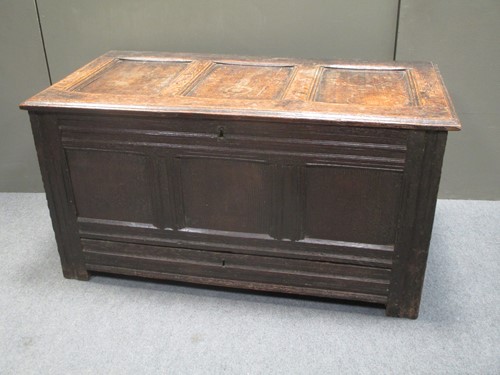 Lot 818 - An 18th century oak coffer with triple...