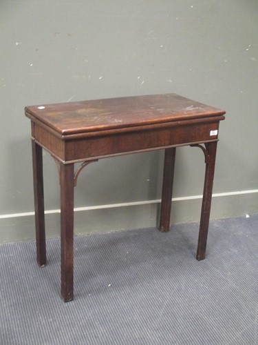 Lot 868 - A George III mahogany fold over top tea or...