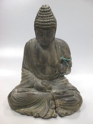 Lot 111 - A wooden buddha, 20th century, 38cm high