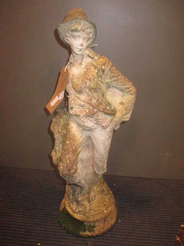 Lot 891 - A garden figure of a barefoot male wearing...