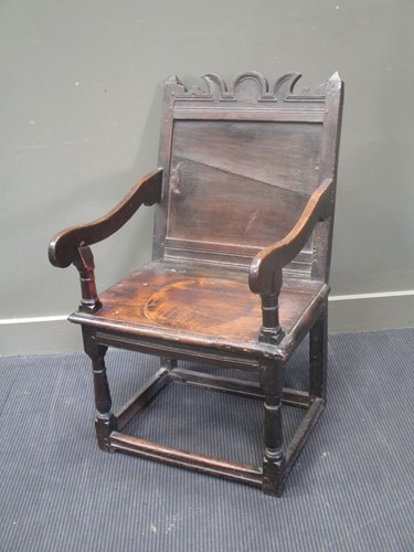 Lot 629 - An early English oak armchair