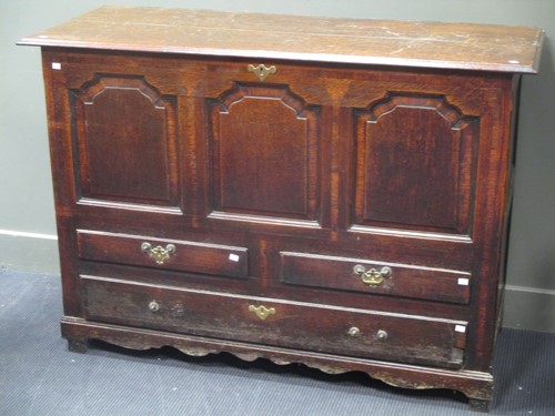 Lot 806 - An English oak mule chest, with three panels...