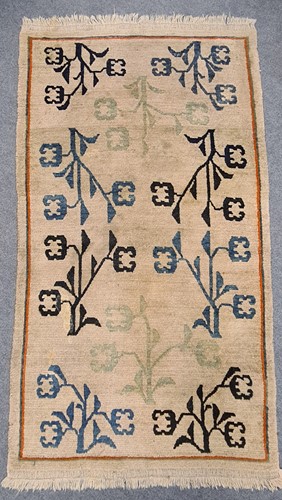 Lot 180 - A harlequin pattern rug, 146 x 82cm; two pale...