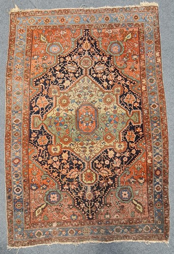 Lot 181 - A small Persian rug with central medallion 155...