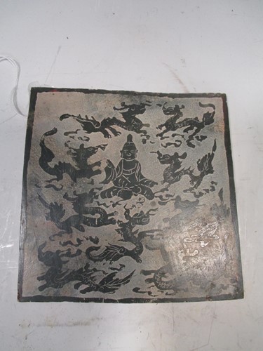 Lot 187 - An East Asian stone panel decorated with a...