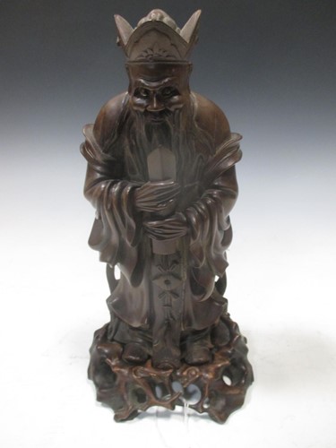 Lot 248 - A carved wood figure of a Chinese immortal,...