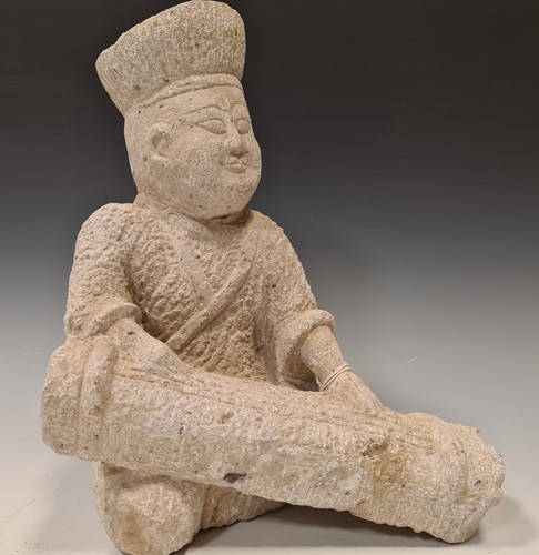 Lot 204 - A Chinese carved grey stone figure of a...
