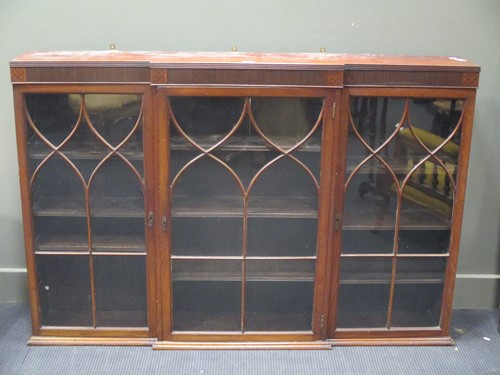 Lot 682 - A George III style mahogany breakfront glazed...