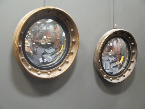 Lot 356 - Two similar Regency style gilt framed convex...