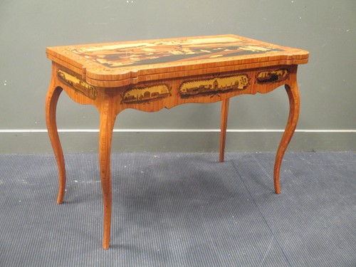 Lot 458 - A North Italian style games table, the top...