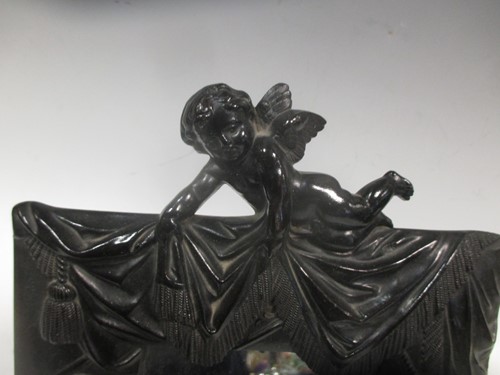 Lot 10 - An early 20th century moulded composition...