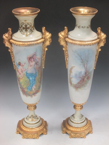 Lot 104 - A pair of slender Sevres style porcelain vases...