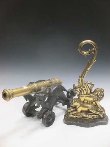 Lot 33 - A brass and cast metal canon, 49cm; together...