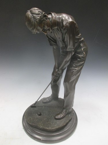 Lot 30 - A bronze model of a golfer putting, 42cm