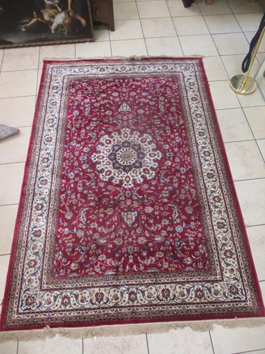 Lot 645 - A Persian style wool rug, with a predominant...