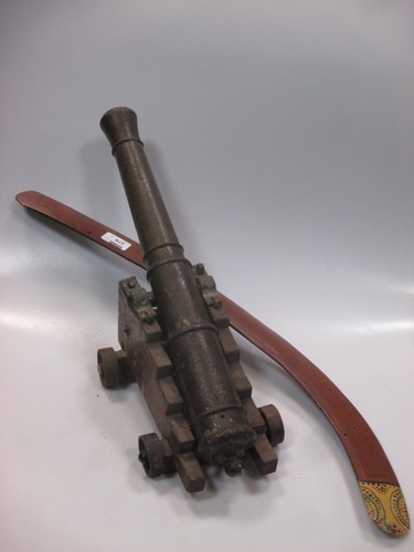 Lot 379 - A model cannon and a boomerang (2)