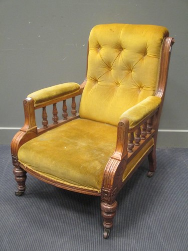 Lot 751 - An Edwardian blonde oak armchair with button...