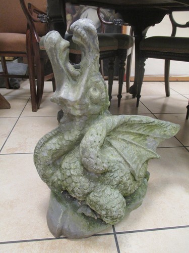 Lot 901 - A lead garden statue of a seated dragon, 60cm...