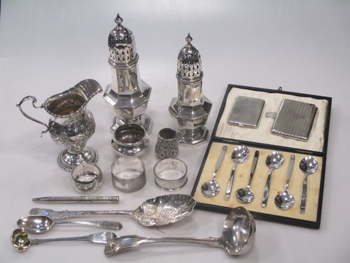Lot 176 - A collection of silverware including casters,...