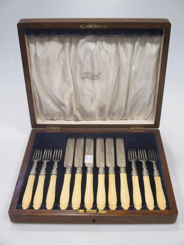 Lot 174 - A cased set of Victorian silver fruit eaters,...