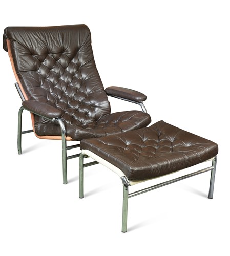 Lot 204 - A buttoned leather and chrome lounge chair and ottoman