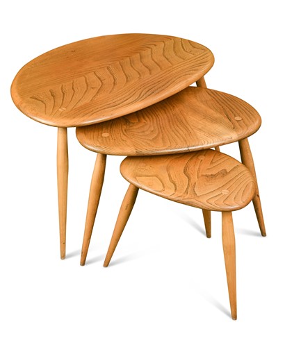 Lot 207 - A nest of three Ercol elm Pebble tables