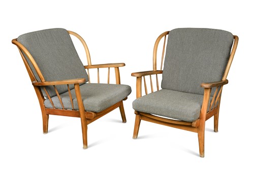 Lot 186 - Attributed to Ercol, a pair of beech framed wingback lounge chairs