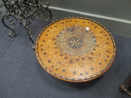 Lot 499 - A shaped wrought iron stand, an inlaid wood...