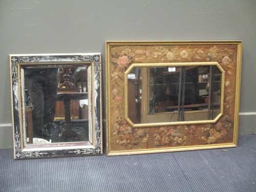 Lot 600 - A needlework frame wall mirror and an ebonised...