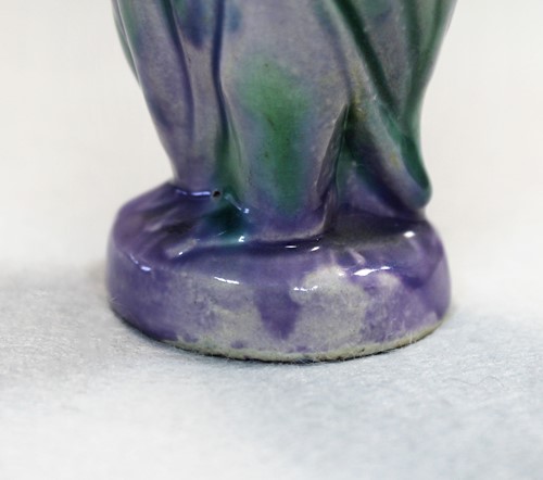 Lot 23 - Attributed to Brannam Pottery, a small grotesque Jug