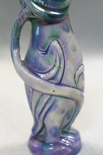 Lot 23 - Attributed to Brannam Pottery, a small grotesque Jug