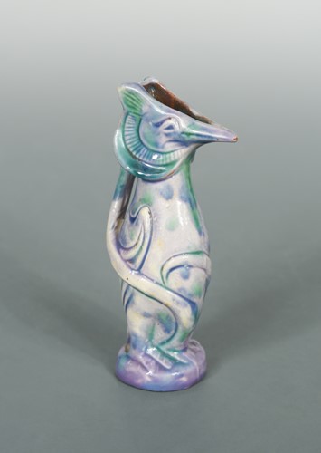 Lot 23 - Attributed to Brannam Pottery, a small grotesque Jug