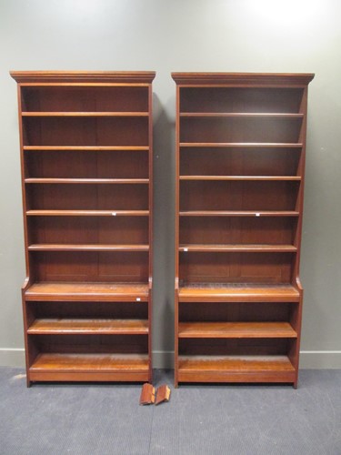 Lot 506 - A near pair of walnut open bookcases with...