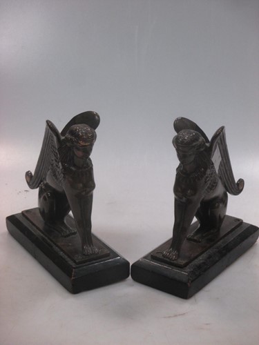 Lot 51 - A pair of bronzed sphinx ornaments, 13 x 13cm