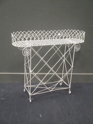 Lot 547 - A wirework plant stand, 82 x 94 x 23cm