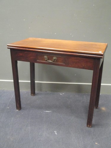 Lot 540 - A George III mahogany fold over top tea table,...