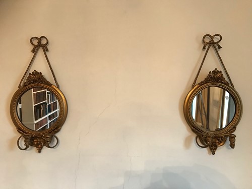 Lot 489 - A pair of gilt composition mirrored wall...
