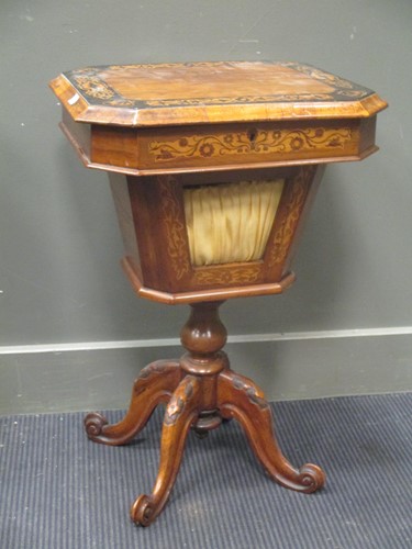 Lot 548 - A walnut and banded work table on four legs 42...