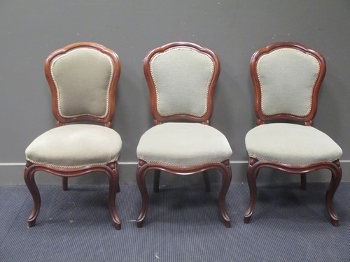 Lot 513 - Three walnut frame upholstered chairs, with...